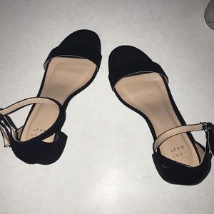 Black velvet high heels.